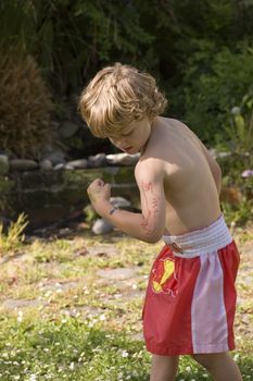 Boy with a super-cool dinosaur tattoo designed by his older brother