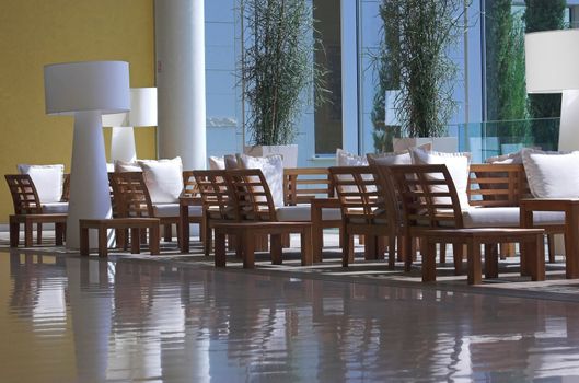 Hotel lobby filled with brown furniture