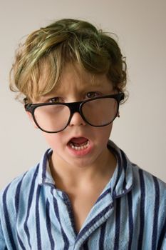 Young male boy hanging around in his pyjamas for the day.