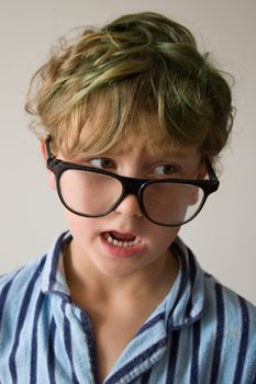 Young male boy hanging around in his pyjamas for the day.