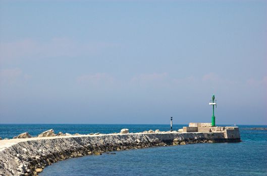 Rocky marina wall in Umag, Croatia