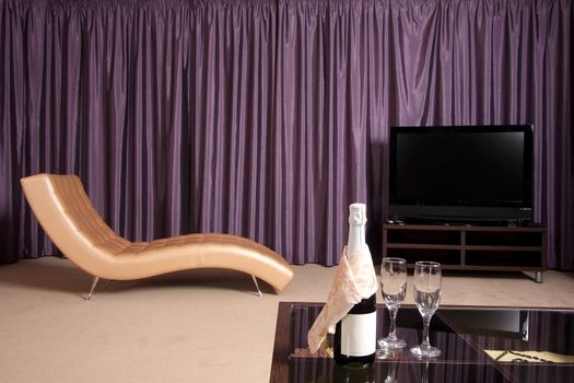 
Beautiful modern interior with a convenient armchair from a genuine leather, the big television screen and a beautiful floor vase