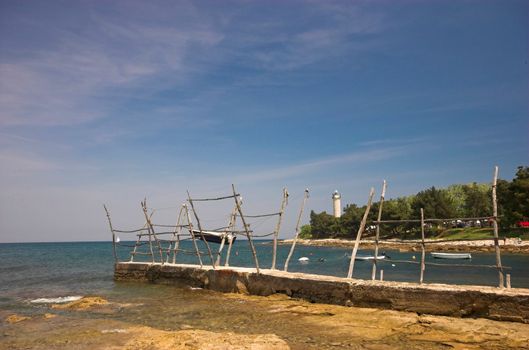 Croatian shore, wooden holders used for lifting boats