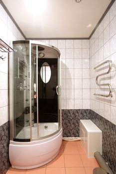 

Modern bathroom with a mirror, a bowl and a convenient per capita booth