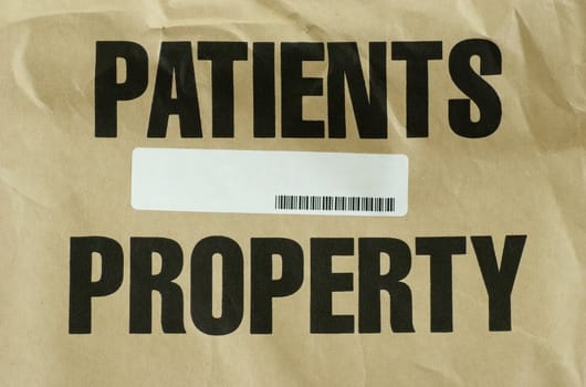 A brown paper bag used at hospitals to hold belongings