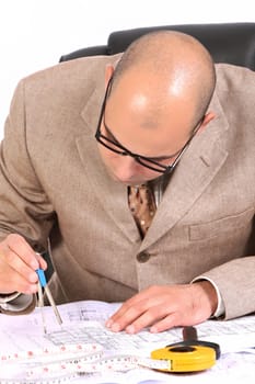 A Businessman working with architectural plans