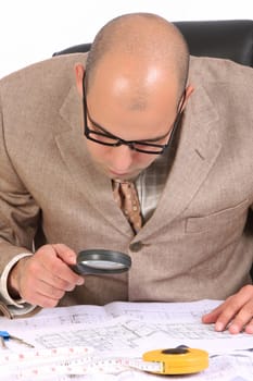 A Businessman working with architectural plans