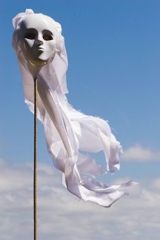 A chilling scarecrow mounted on a pole. Scares more than just birds