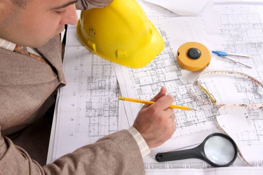 A Businessman working with architectural plans