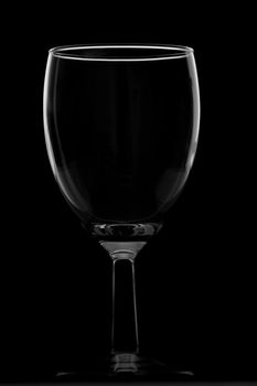 Short empty wine glass isolated on black