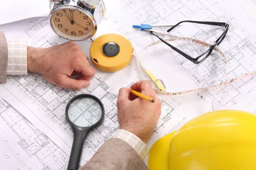 A Businessman working with architectural plans