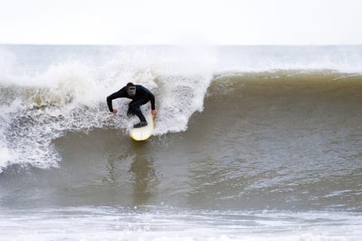 Surfing the break at Haumoana Beach, Hawke's Bay, New Zealand