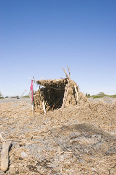 A shelter made from driftwood, Haumoana Beach, Hawke's Bay, New Zealand.