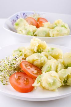 Fresh vegetarian potato salad with vegetables.