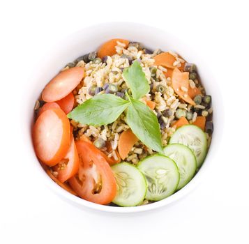 Delicious Asian Vegetable Fried Rice, containing tomato, cucumber, chinese long bean, and basil.