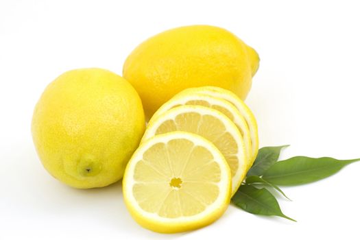 whole lemon and slices on white background 
