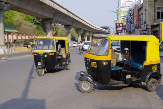 Autorickshaw taxis on M.G road, Bangalore (Bengalaru), India.