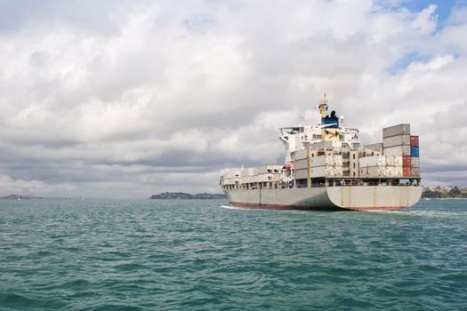 A ship leaves Auckland Harbour in the Hauraki Gulf, New Zealand