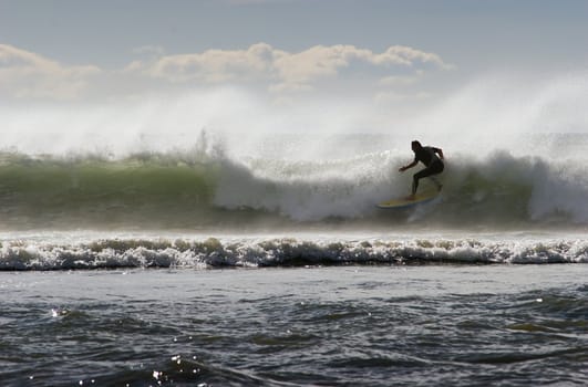 Surfing the break at Haumoana Beach, Hawke's Bay, New Zealand