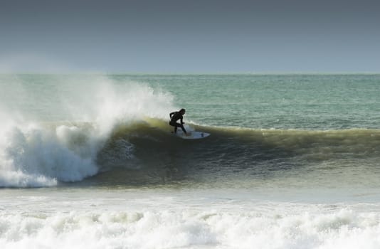 Surfing the break at Haumoana Beach, Hawke's Bay, New Zealand