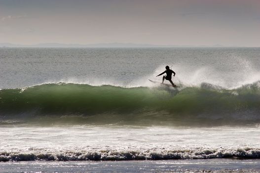 Surfing the break at Haumoana Beach, Hawke's Bay, New Zealand