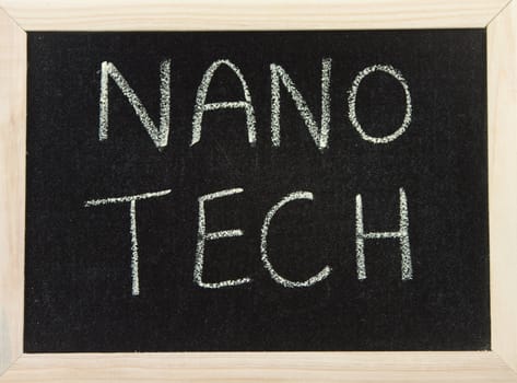 A black board with a wooden frame and the words 'NANO TECH' written in chalk.