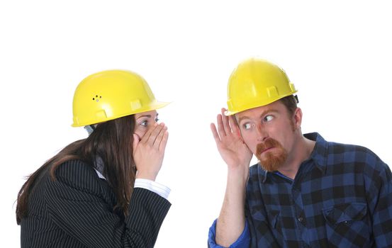 businesswoman gestures telling something to construction worker on workplace