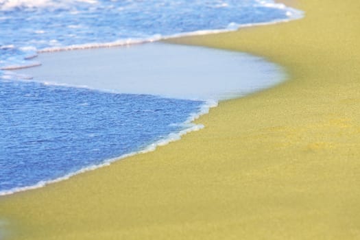 details of sea waves on tropical beach