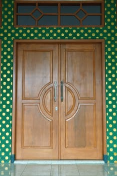 wooden door for entering masjid hall