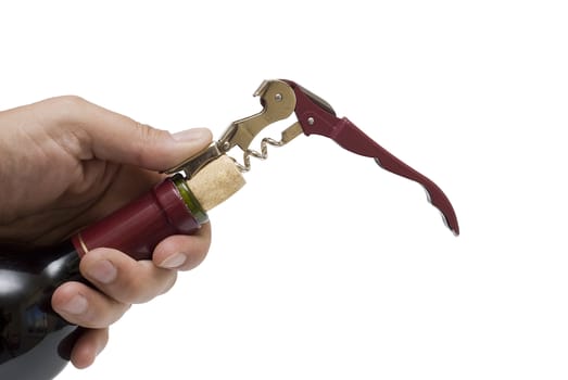 Corkscrew opening a red wine bollte over a white background.