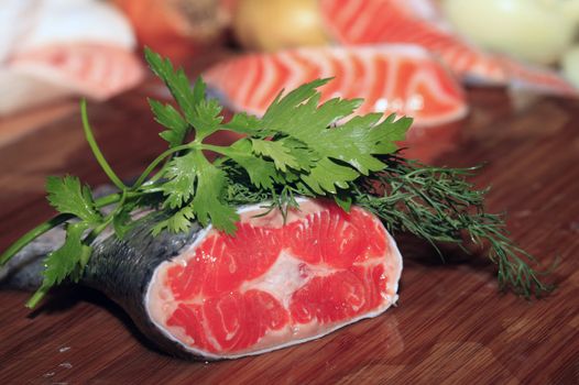 Fresh red salmon fish on wooden cooking desk