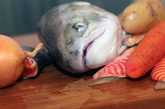 Fresh red salmon fish on wooden cooking desk