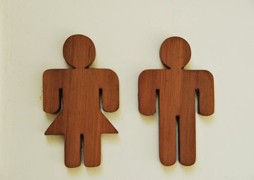 photo of a toilet wooden sign