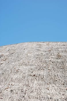 photo of a bungalow roof with sky background