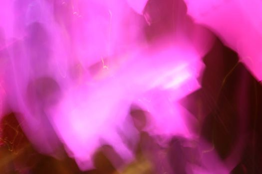 A very pink photo of a long exposure in a nightclub (hur hur).