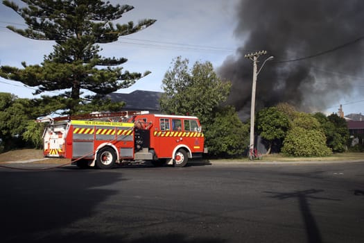 Firemen attend a house fire in Haumoana, New Zealand