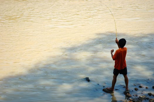 man doing for fishing beside the river