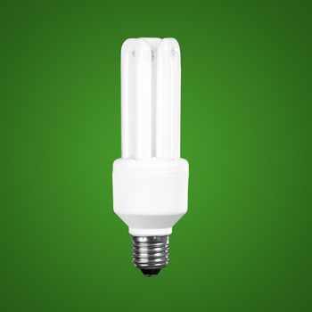 Fluorescent Light Bulb on a green background, energy concept