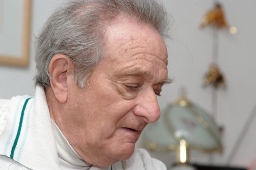 Head of elderly man with thoughtful expression 