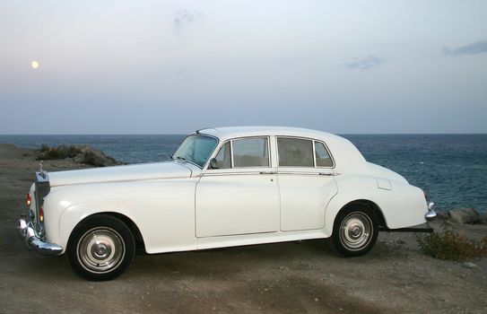 Side 3/4 profile of a white luxury car