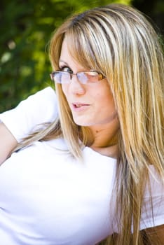portrait of beautiful young blond woman with glasses