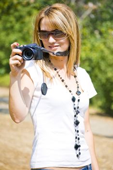beautiful young woman taking photos