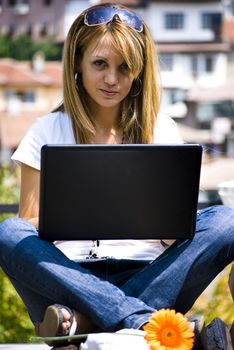 beautiful young woman working out with laptop or notebook