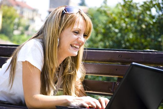 beautiful young woman working out with laptop or notebook