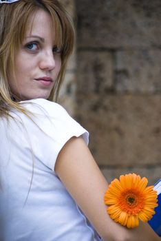 beautiful young blonde woman with flower