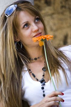 beautiful young blonde woman with flower