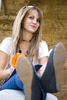 beautiful young blonde woman with flower