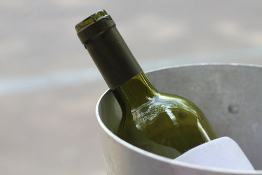 wine bottle in a metal cooler