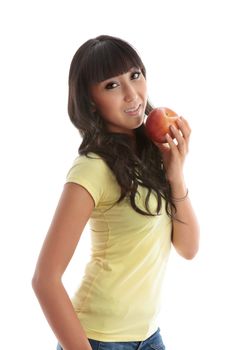 A young pretty woman eating a healthy juicy apple.  White background.