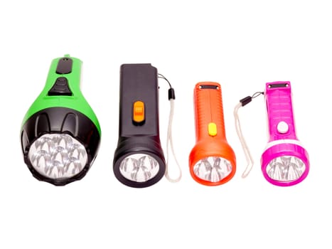 four differently colored LED flashlight on a white background 